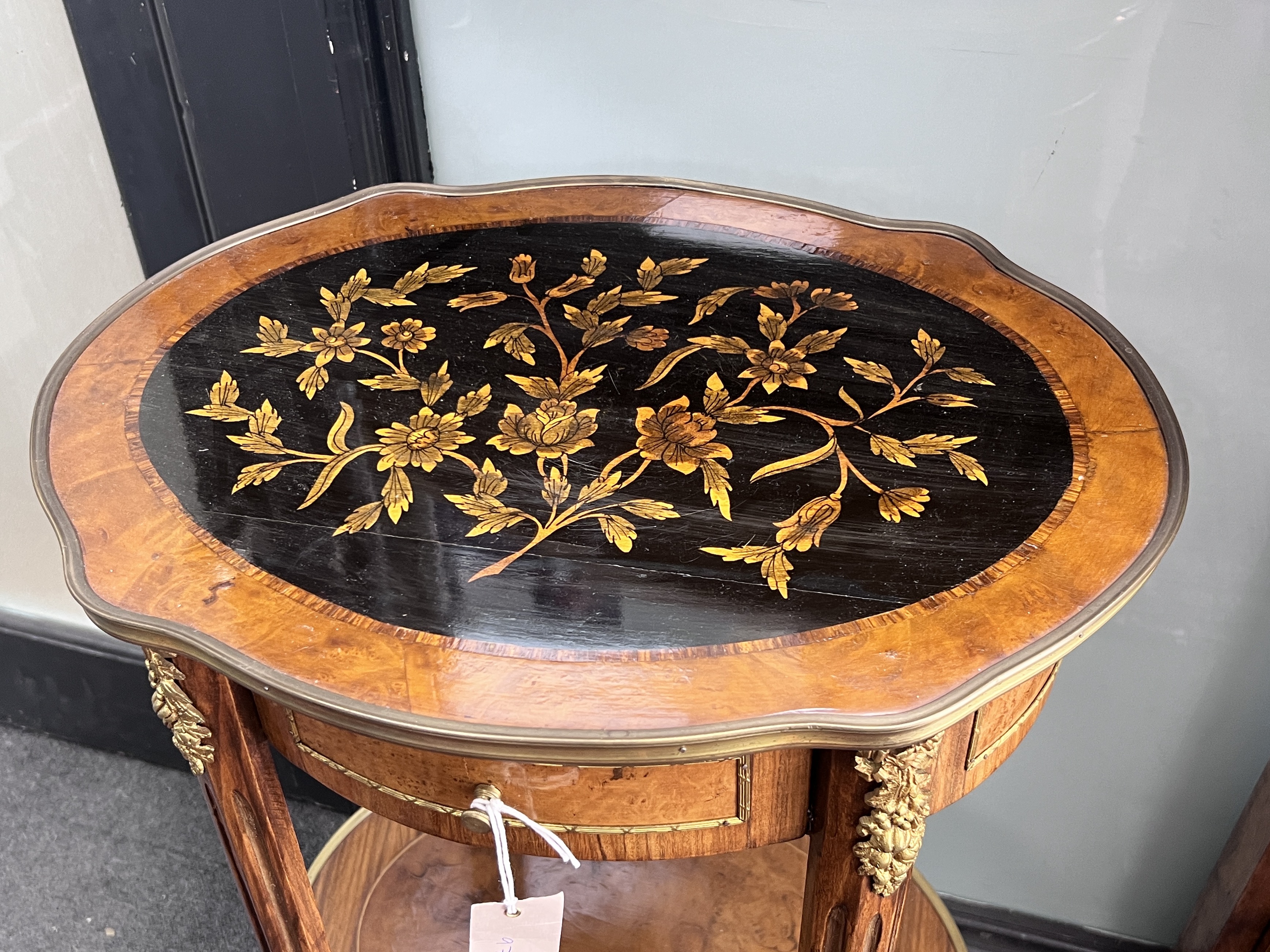 A Louis XVI style inlaid gilt metal mounted two tier table, width 47cm, depth 37cm, height 83cm